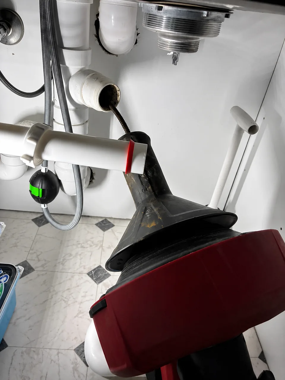 A&G clearing a clogged drain in a Woodstock home