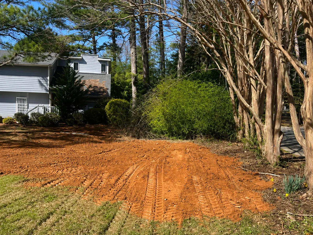 Metro Atlanta yard backfilled and regraded after an A&G Plumbing sewer line replacement, ready to reseed